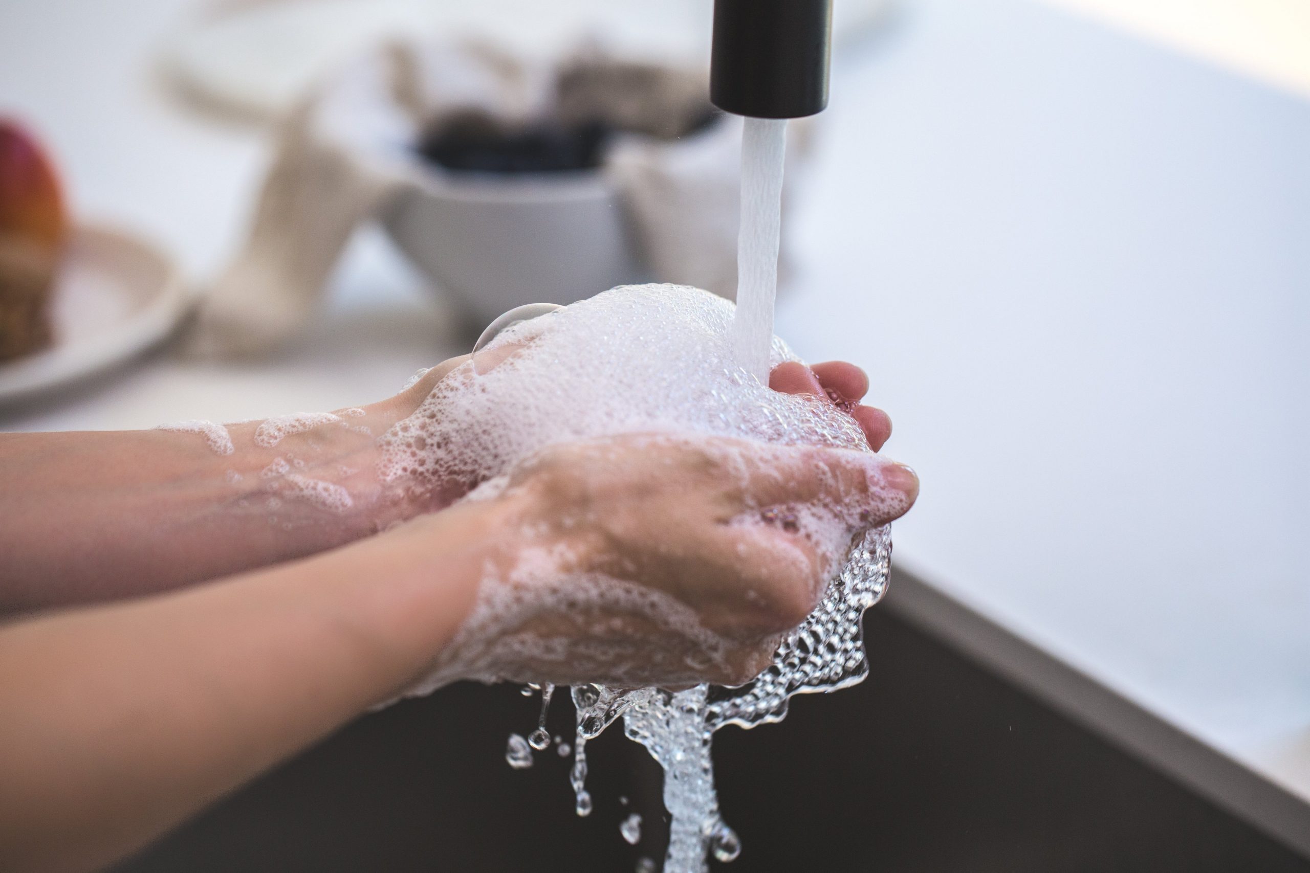 Canva - Person Washing His Hand